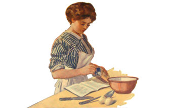 Woman making recipe from a cookbook.