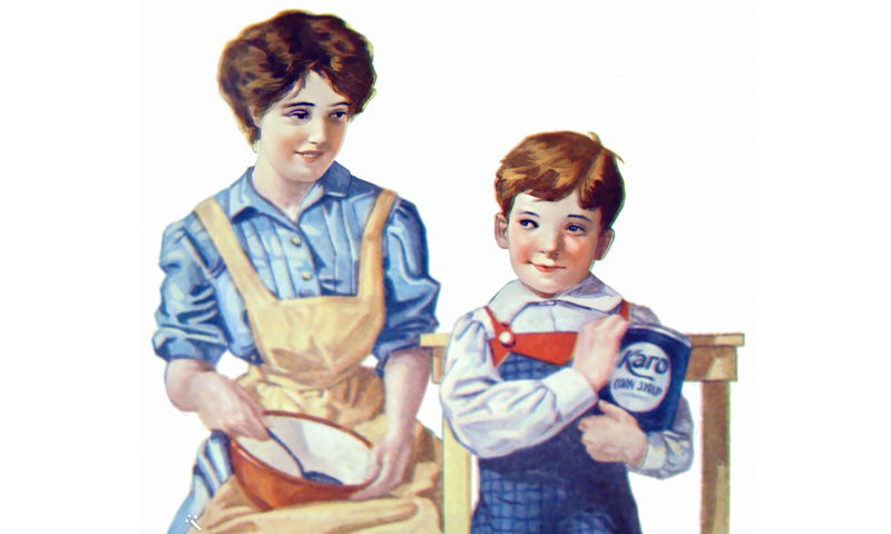Young woman sitting stirring mixing bowl with a spoon, amused at child hogging the can of Karo syrup.