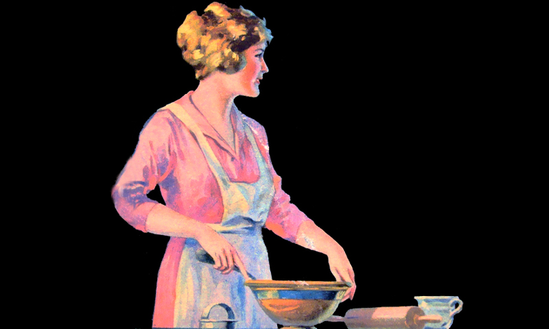woman with pink dress and white apron mixing batter.