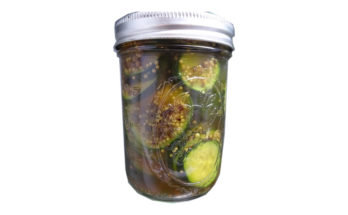 glass jar of sandwich pickles.