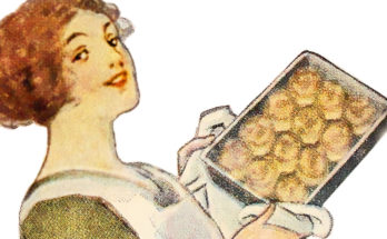 Woman holding up pan of baked biscuits, 1911.