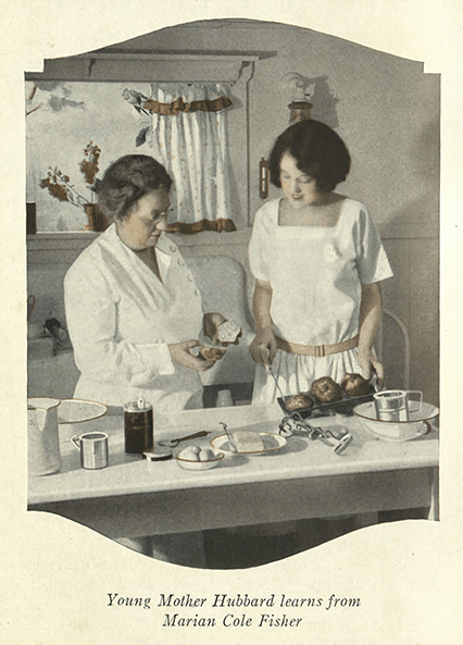 Marion Cole Fisher instructing Mother Hubbard on how to bake.